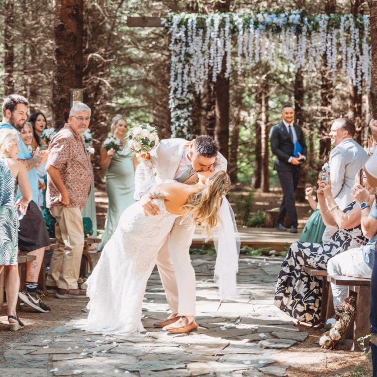 Bride and groom share a celebratory kiss after their ceremony at their Larkin Place wedding in Olympia, WA