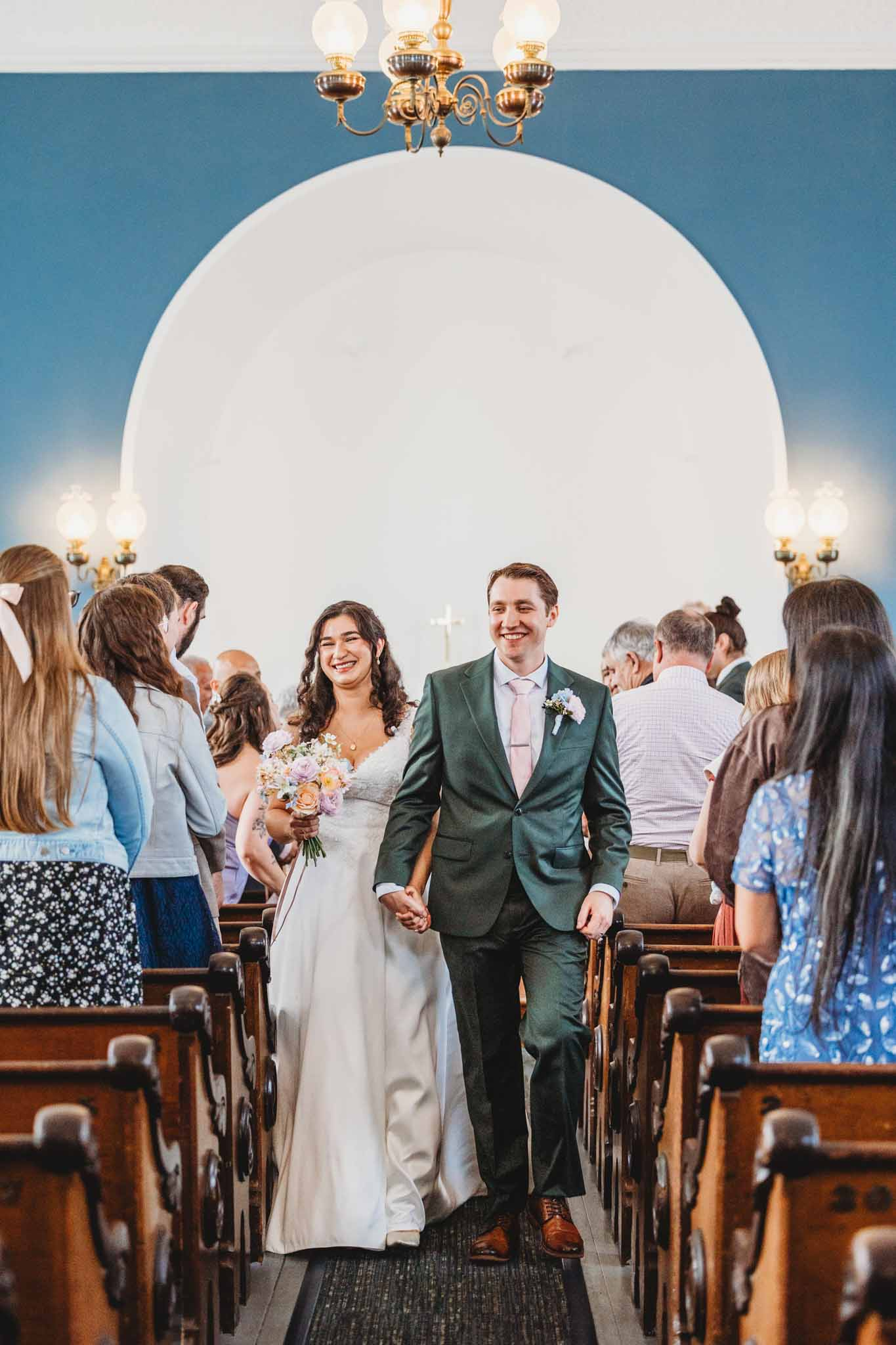 Bride & Groom recessional after a Port Gamble wedding ceremony at St. Paul's Church