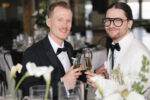 Couple toasting during their Seattle wedding reception at the Point at Pier 70
