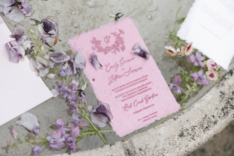 Wedding invitations floating in water